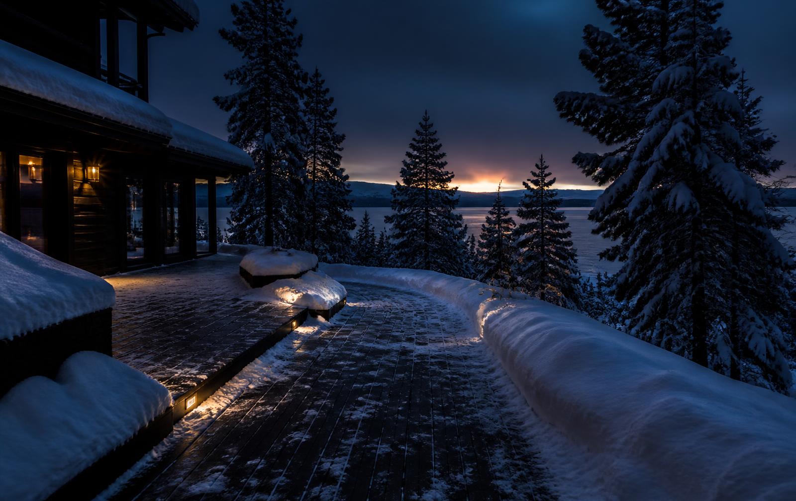 Plowed driveway and cleared walkway at a Nevada property in winter